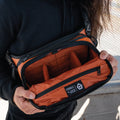 Sedona Orange Lifestyle Image Six Liter ROGUE Sling