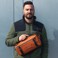 Sedona Orange Lifestyle Image Nine Liter ROGUE Sling