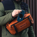 Sedona Orange Lifestyle Image Nine Liter ROGUE Sling