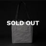 House of Exploration Dyneema WANDRD Tote Backpack Front, Straps extended with white text that reads Sold Out