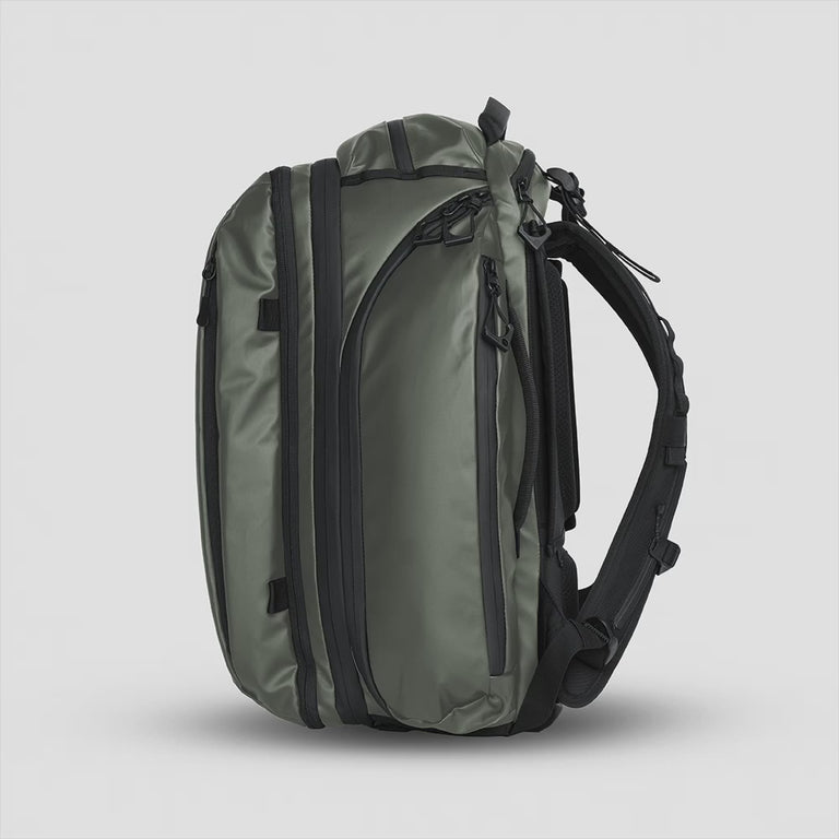 TRANSIT Travel Backpack Green Side Expansion Zipper opening and closing | variant_ids: 40548722933802, 40548722999338